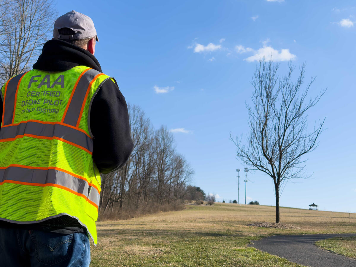 FAA-certified drone pilot FAA-certified drone pilot in a safety vest